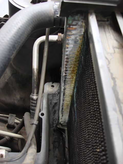 1983 Ford Bronco - you have to use the 3/4 hose wrench to remove the oil cooler lines. you can see the leak was worse than i thought.