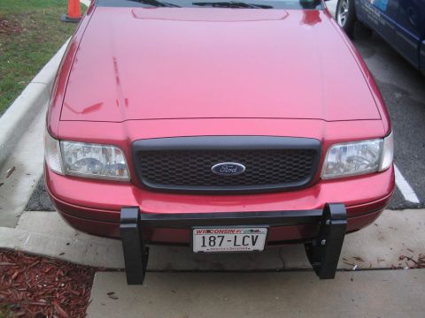 2001 Ford Crown Victoria - A true Setina Body Guard. Streipped and repainted with matte black Rustoleum, then cleared. Matches the other black moulding on the car per…