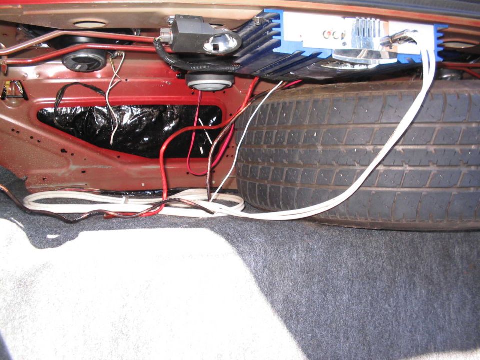 What's running that 10 year old 8" sub you ask? A 10 year old 200W Jensen amp.

Meh, it works, and is technically free.

(update) Blew the sub and replaced it. Might have another amp (250W Kenwood) to replace the Jensen someday when i feel like crawling back in the trunk.