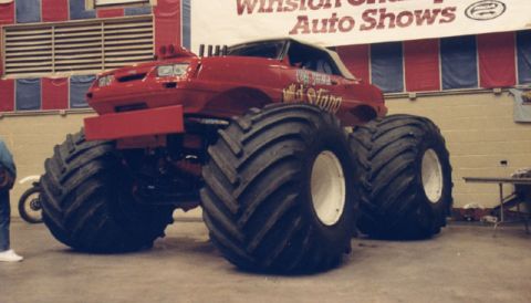 1981 Ford Bronco - Monster truck with "Wild Stang" graphics is displayed indoors under a banner for Winston Auto Shows.