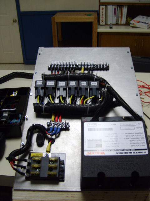 2004 Ford Crown Victoria - Custom electrical panel with relays, fuses, and a Whelen Power Airhorn module installed.