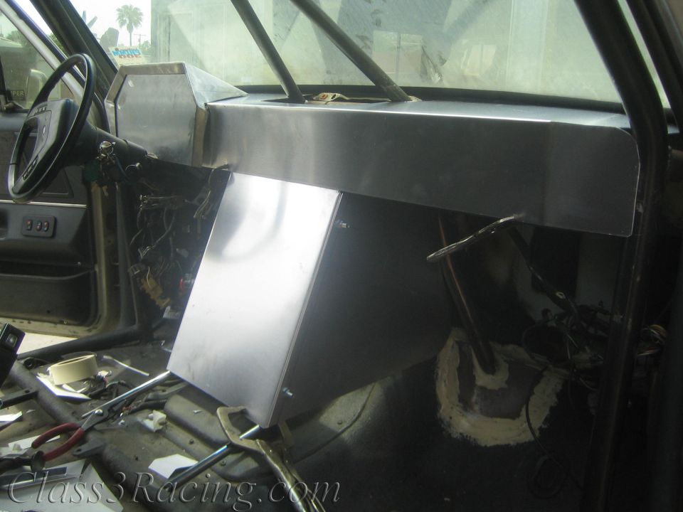 Fabricated aluminum dashboard and center console in a stripped vehicle interior