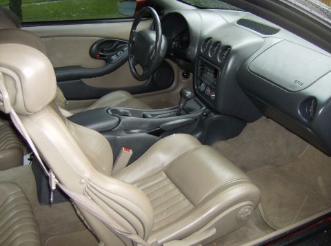 1996 Pontiac Trans Am - Interior view of a 1996 Pontiac Trans Am, tan leather seats, dashboard, and center console.