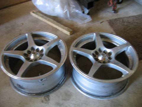 1993 Ford Probe - A pair of aftermarket aluminum wheels are shown, possibly for sale or repair.