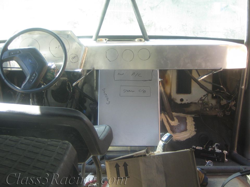 Aluminum dash with hand-marked gauge layout and notes in stripped cabin