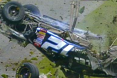 1981 Ford Bronco - A race car is seen upside down, with "57" prominently displayed on its side and the "SUPERMOTORS" logo visible.