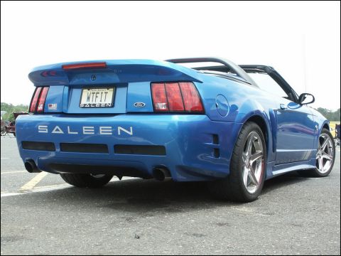 2001 Mercury Grand Marquis - Rear view of a blue Saleen Mustang convertible with custom license plate.