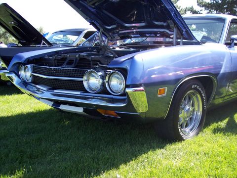 1972 Ford Ranchero - Blue 1970 Ford Ranchero with its hood open, parked on grass next to another vehicle.