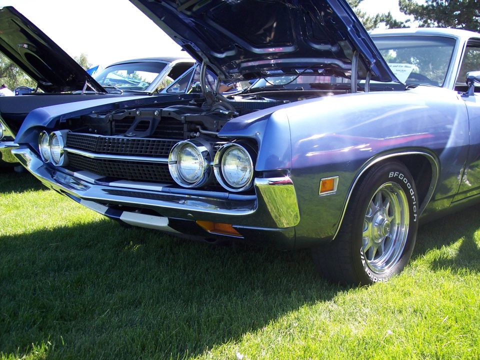Blue 1970 Ford Ranchero front quarter view, hood open, BFGoodrich tires
