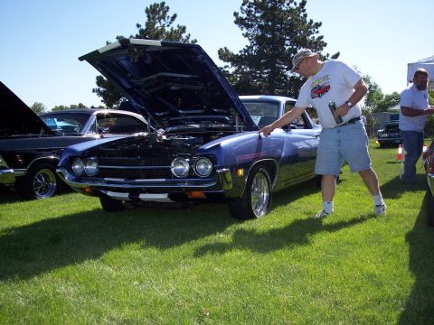 1972 Ford Ranchero - A blue 1972 Ford Ranchero is displayed with its hood open at an outdoor car show.