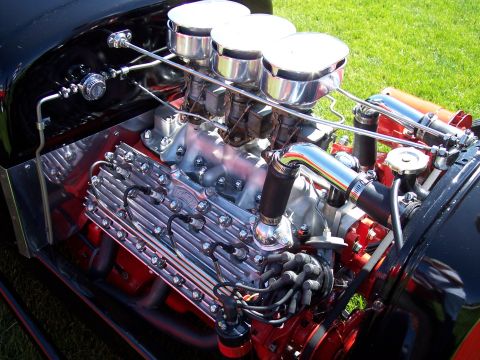 1972 Ford Ranchero - Close-up of a custom V8 engine with polished aluminum valve covers and chrome air cleaners.