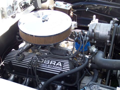 1972 Ford Ranchero - Close-up of a Ford Cobra engine, "POWERED BY FORD" valve covers and a chrome air cleaner.