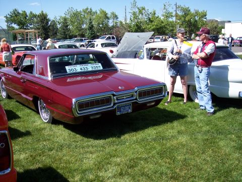 1972 Ford Ranchero - Rear view of a maroon 1967 Ford Thunderbird at a car show, with a "FOR SALE" sign and phone number displayed in the rear window.
