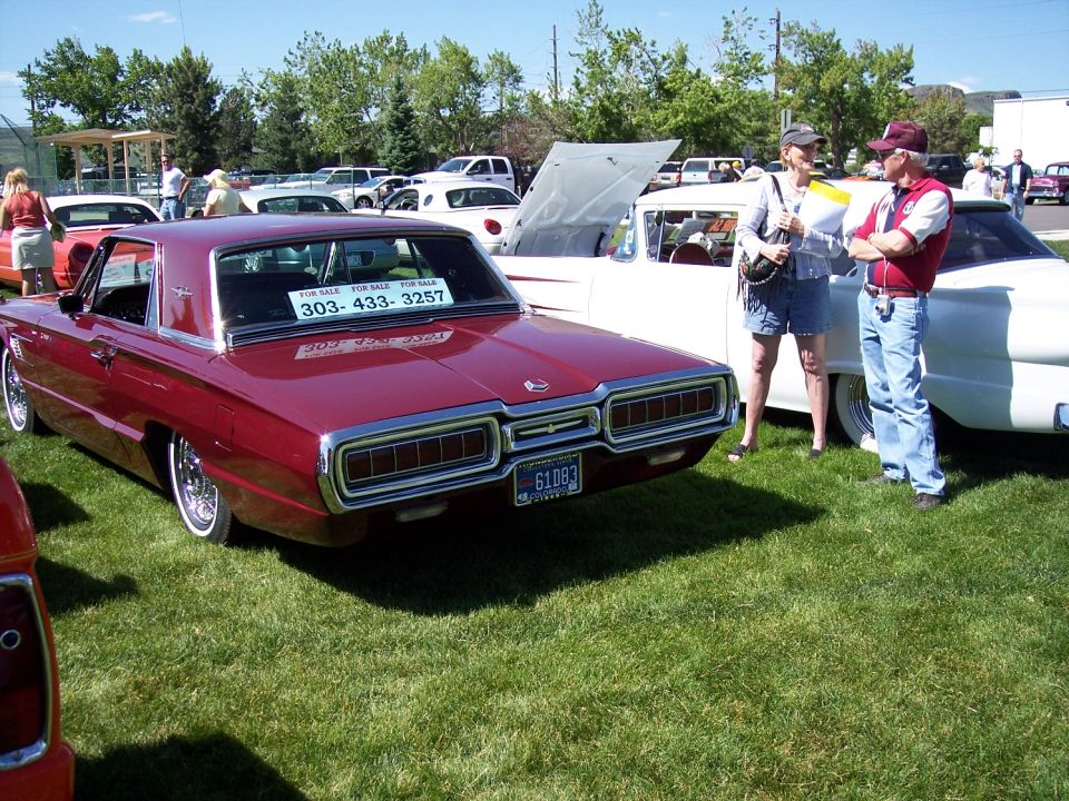 Maroon 1967 Ford Thunderbird rear view with "FOR SALE" sign in window