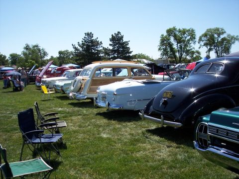 1972 Ford Ranchero - A gathering of vintage automobiles displayed on a sunny day at an outdoor event.
