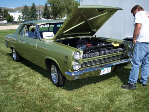 1972 Ford Ranchero - Green 1967 Ford Fairlane 500 parked on grass, hood up showing engine bay.