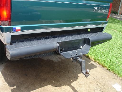 1996 Ford F-150 rear bumper with hitch receiver and Texas flag sticker