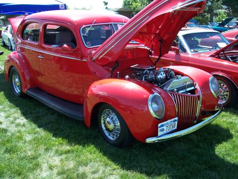 1972 Ford Ranchero - A red 1939 Ford sedan is displayed with its hood open, revealing the engine compartment.