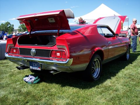 1972 Ford Ranchero - A red 1971 Ford Mustang is displayed with its trunk and hood open at an outdoor gathering.