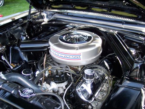 1972 Ford Ranchero - The engine bay of a classic car is shown with a prominent air cleaner and various engine components.