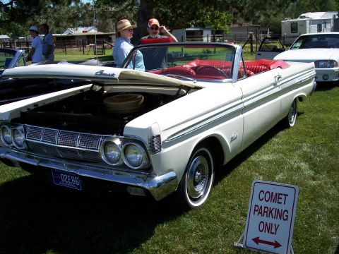 1972 Ford Ranchero - A white convertible with a red interior is parked on grass with a "Comet Parking Only" sign nearby.