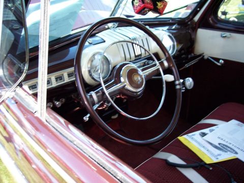 1972 Ford Ranchero - The interior of a classic automobile features a large steering wheel and a dashboard with multiple gauges.
