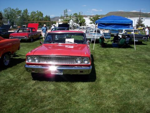 1972 Ford Ranchero - A red 1964 Ford Falcon Ranchero is parked on grass at an outdoor event.
