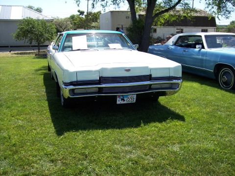 1972 Ford Ranchero - Front view of a 1972 Ford LTD with a two-tone paint scheme, parked outdoors.