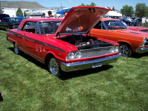 1972 Ford Ranchero - A red 1962 Ford Falcon Ranchero is displayed with its hood open at a car show, with another vehicle visible behind it.