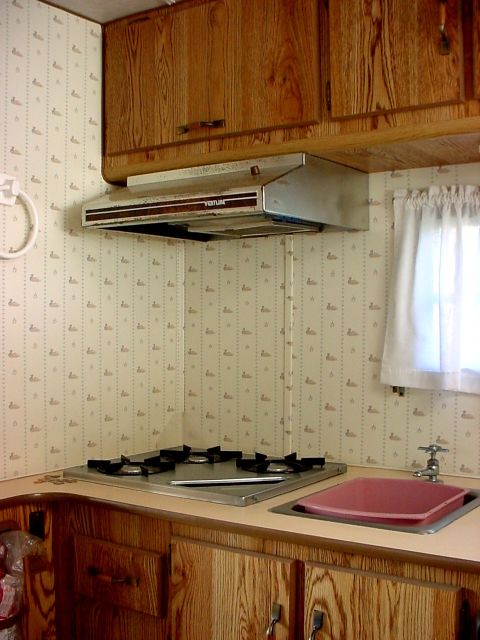 2000 Ford Taurus - Interior view of a recreational vehicle's kitchenette area, a stove and sink.