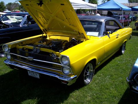1972 Ford Ranchero - A bright yellow 1966 Ford Fairlane Ranchero is displayed with its hood open at a car show.
