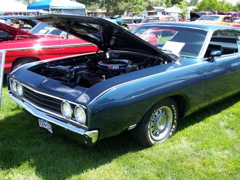 1972 Ford Ranchero - A blue 1970 Ford Ranchero is displayed with its hood open at an outdoor event.