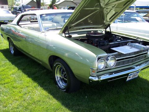 1972 Ford Ranchero - This light green 1970 Ford Torino GT convertible displays its engine with the hood open, chrome wheels and a distinctive grille.