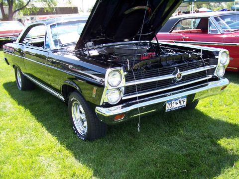 1972 Ford Ranchero - A black 1968 Ford Ranchero is displayed with its hood open at an outdoor event.
