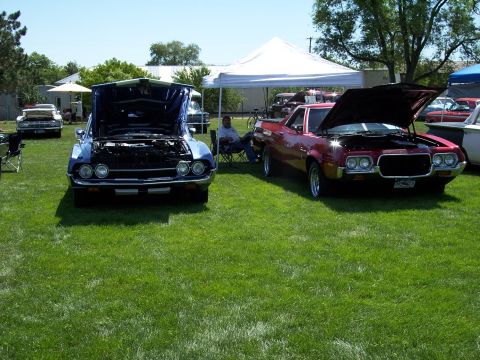 1972 Ford Ranchero - Two classic Ford Rancheros are displayed with hoods open at a car show.