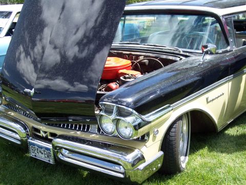 1972 Ford Ranchero - A vintage two-tone car with its hood open, revealing the engine compartment.