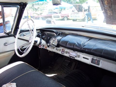 1972 Ford Ranchero - Interior view of a classic car, with other vehicles seen in the background at an outdoor event.