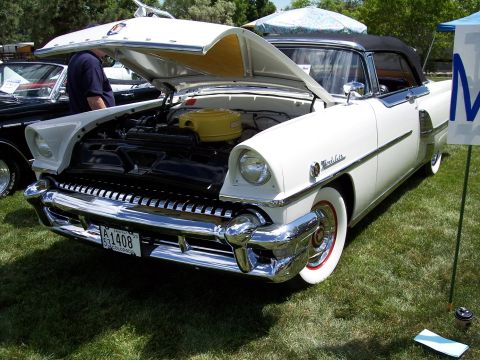 1972 Ford Ranchero - White 1956 Mercury Montclair convertible at a car show, hood up revealing the engine bay.