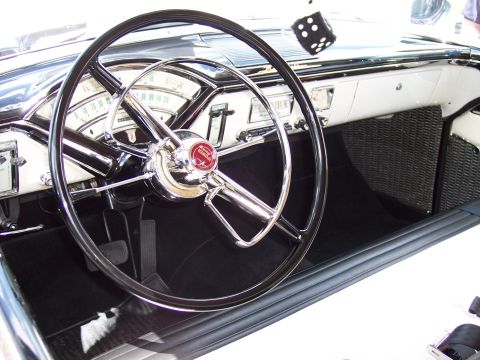 1972 Ford Ranchero - A close-up view of a vintage car's interior, a classic steering wheel and dashboard.
