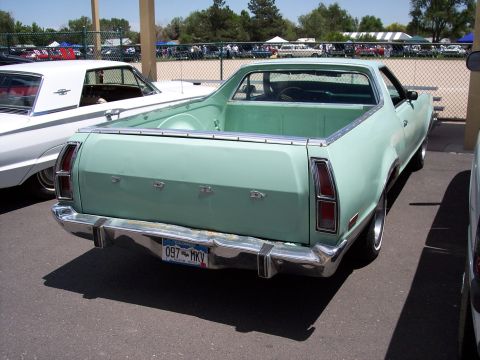 1972 Ford Ranchero - A light green 1972 Ford Ranchero is parked at an outdoor event with other vehicles visible in the background.