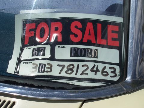 1972 Ford Ranchero - A 'For Sale' sign with year, model, and phone number is displayed on a vehicle's windshield.