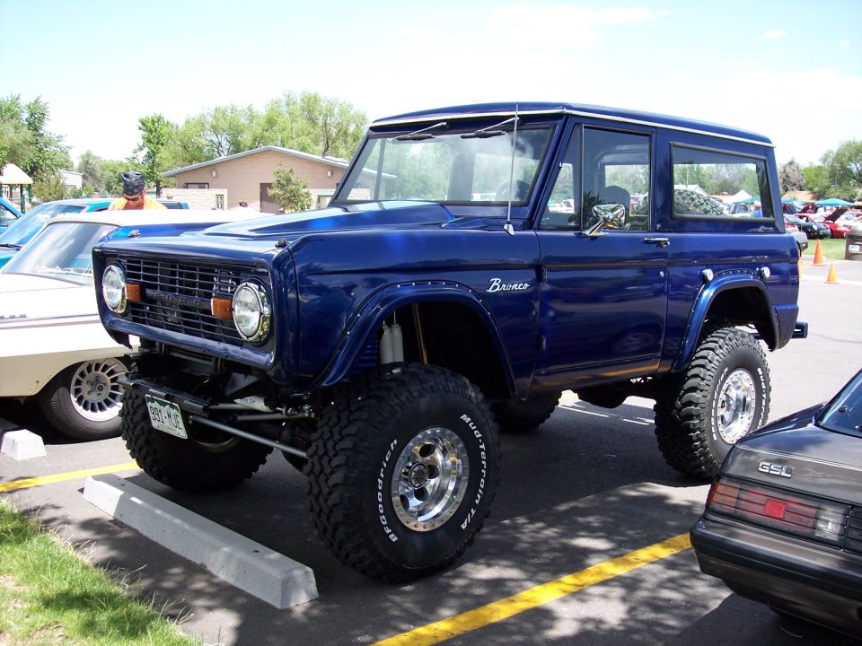 Blue 1972 Ford Bronco with lifted suspension and off-road tires