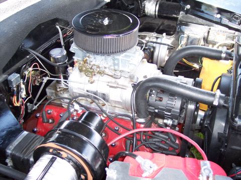 1972 Ford Ranchero - Close-up view of a V8 engine bay, a carburetor and air filter assembly.