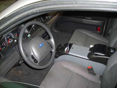 2004 Ford Crown Victoria - Interior of a 2004 Ford Crown Victoria, focusing on the driver's side and passenger seating area.