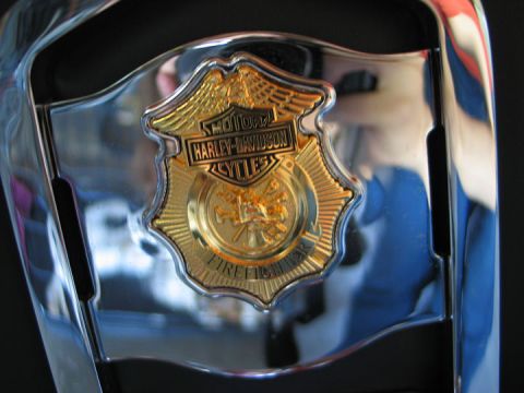 1994 Ford Bronco - Close-up of a Harley-Davidson Firefighter badge with chrome accents.