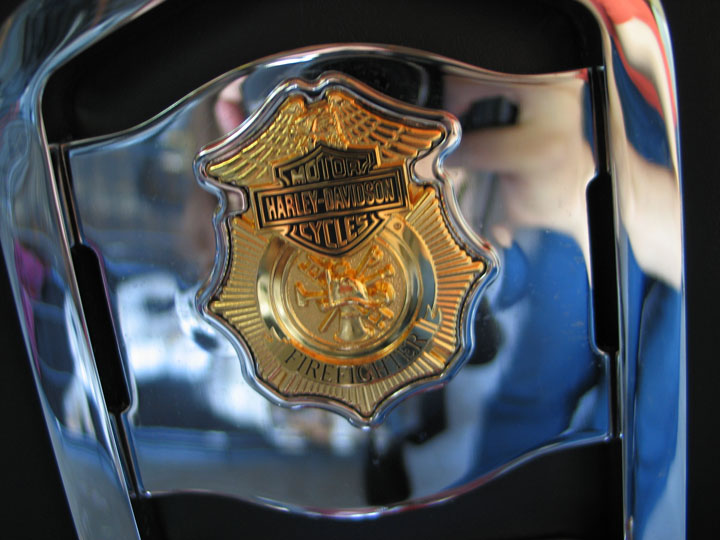 Harley-Davidson Firefighter badge on chrome