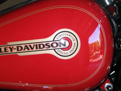 1994 Ford Bronco - Close-up of a red Harley-Davidson gas tank a special edition emblem.
