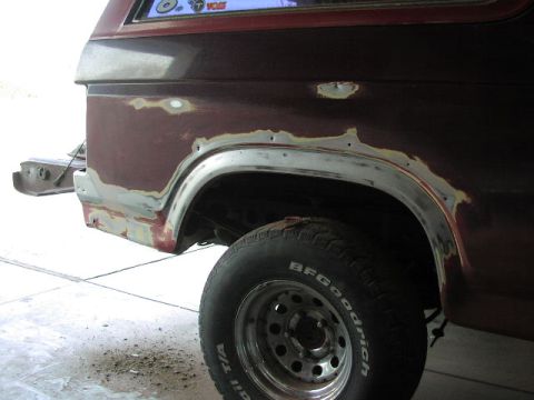 1981 Ford Bronco - Bodywork in progress on a 1981 Ford Bronco, showing filler and primer on the rear quarter panel.