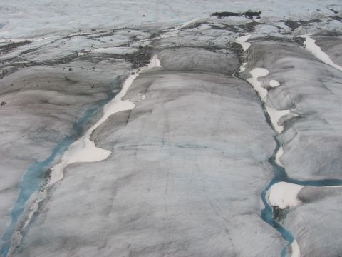 1973 Ford Ranchero - Meltwater streams carve paths through a vast glacier, highlighting the dynamic nature of icy landscapes.