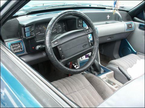 2001 Mercury Grand Marquis - The interior of a car is shown, a dashboard, steering wheel, and seats.